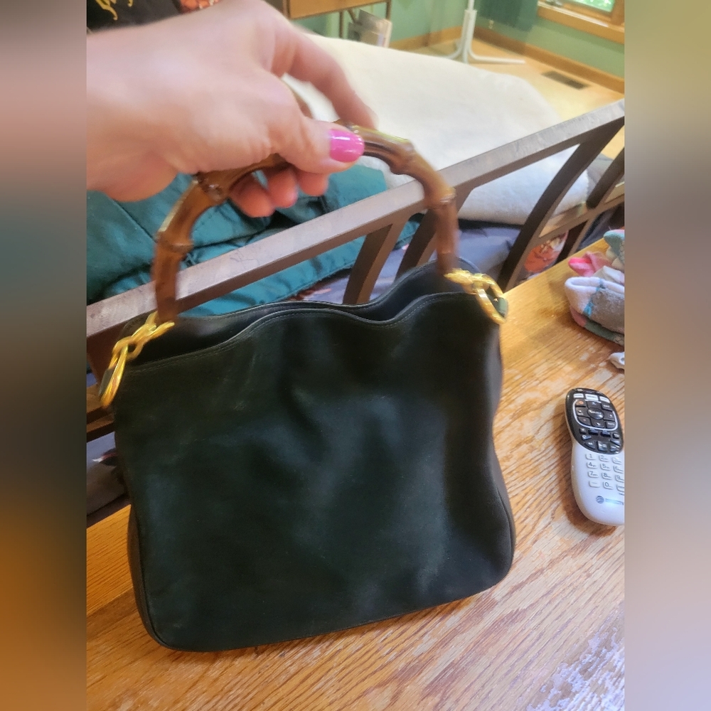 A vintage dark green suede Gucci handle bag!